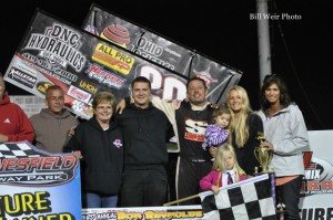 Greg Wilson with his family and crew in victory lane after winning the Bob Reynolds Memorial at Waynesfield Raceway Park. - Bill Weir Photo